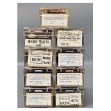 Nine Kadee N Scale Micro-Trains Box cars in Clear Cases