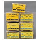 Seven AHM Minitrains N Scale Freight Cars in Clear Cases