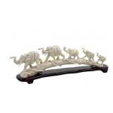 FIVE ELEPHANT RESIN BRIDGE ON STAND