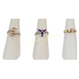 THREE 10K GOLD GEMSTONE RINGS