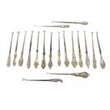 EIGHTEEN STERLING HANDLED BUTTON HOOKS