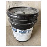 Black pail of universal tractor hydraulic fluid