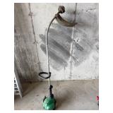 Green weedeater trimmer