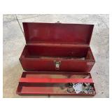 Red metal tool box with contents
