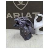 gargoyle creature with a metallic, iridescent