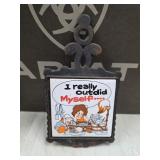 vintage cast iron and ceramic tile trivet