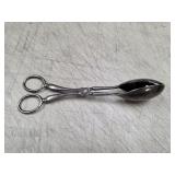 vintage scissor-style salad tongs are likely
