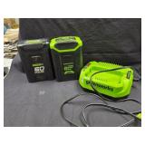 Greenworks 60V batteries and a charger.
