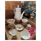 Flat of tea cups, saucer, and pitcher