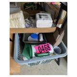 Basket of plastic drinking mugs and paperware