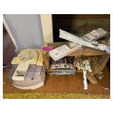 Vaporizer, mini blinds, scrap book, wood shelf