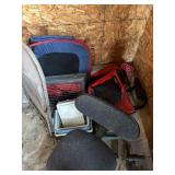 Contents of corner: coolers, desk chair, folding
