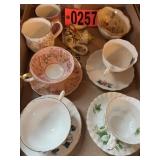 Flat of assorted Bone in China cups and saucers