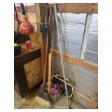 Contents of corner: broom, yardstick, hand