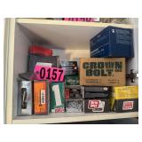 Shelf contents: Assorted screws, bolts,