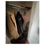 Closet contents: sweepers, ladies leather coat,