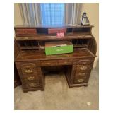 Large wooden roll-top style writing desk with