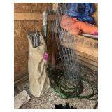 Bag of steel tent posts and assorted fencing