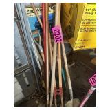 Contents of corner: shovels, post hole digger,