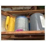 Shelf contents: metal fuel cans, plastic fuel can