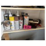 Shelf contents: grease, paints, toolmat