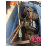 Blue tote lot: long-handled grill tools, floor