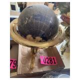 World globe on gold metal base