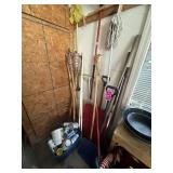 Contents of corner: tiki torches, box of paints,