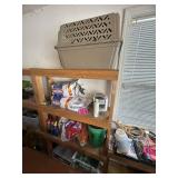 Shelf contents: Pet carrier, charcoal, topsoil,
