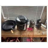 Shelf lot: Cast iron pan, air fryer, and dog