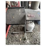 Adjustable shop table and propane tank