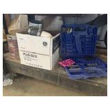 Contents of bottom shelf: partial drill bit set,