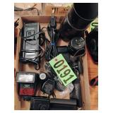 Flat of assorted camera equipment lens flash