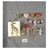 Assorted pins/broaches and 4 heart worry stones