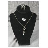 Necklace and earring set featuring interlocking