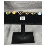 (6) gold and sliver tone rings featuring various