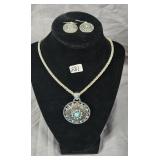 Faux turquoise medallion pendant on silver tone