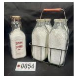 (4) Vonderhaar Bros., Inc. milk bottles w/ wire
