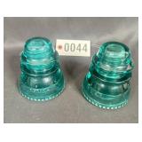 (2) green glass insulators