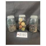 Glass jars with zinc lids and decorative filler,