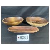 Group of primitive wooden bowls and trencher,