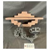 Wrought iron wall sconce and wood shelf