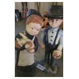 Cement matching Amish boy and girl yard ornaments