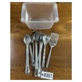 Tub of metal kitchen utensils - spatulas, spoons,