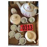 Glass musical tea pot and assorted tea cups