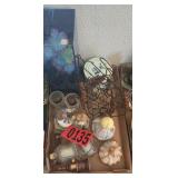 Ceramic collectibles and floral arrangements