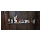 Shelf of collectibles with Jesus figurine