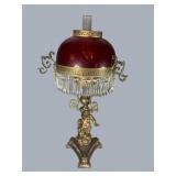 Ornate brass cherub karosene parlor lamp with