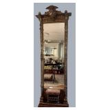 Heavy, ornate, bevelled hall mirror with brown