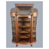 Oak China cupboard with curved glass front, lions